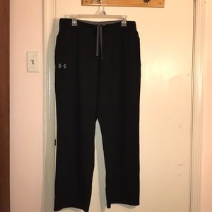 Men’s black Under Armour track pants.